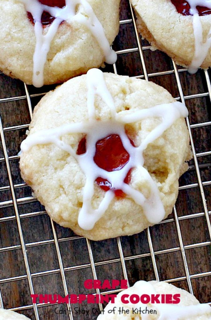 Grape Thumbprint Cookies | Can't Stay Out of the Kitchen | these amazing #cookies are filled with #grape jam & glazed with a powdered sugar icing. They're wonderful for any kind of #holiday or special occasion #baking. #dessert