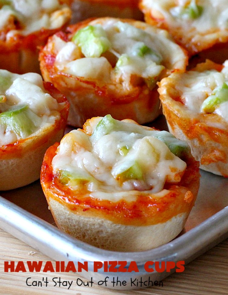 Hawaiian Pizza Cups | Can't Stay Out of the Kitchen | these fantastic miniature #pizzas are the best #appetizer of choice for #tailgating parties or the #SuperBowl! They're filled with spaghetti sauce, #ham, #pineapple & green bell pepper. Every bite is so mouthwatering, you'll be fighting others for the last one! #MozzarellaCheese #PillsburyRefrigeratedBiscuits #MiniaturePizzas #HawaiianPizzaCups