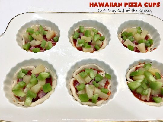Hawaiian Pizza Cups | Can't Stay Out of the Kitchen | these fantastic miniature #pizzas are the best #appetizer of choice for #tailgating parties or the #SuperBowl! They're filled with spaghetti sauce, #ham, #pineapple & green bell pepper. Every bite is so mouthwatering, you'll be fighting others for the last one! #MozzarellaCheese #PillsburyRefrigeratedBiscuits #MiniaturePizzas #HawaiianPizzaCups