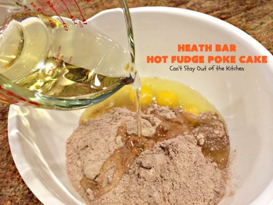Heath Bar Hot Fudge Poke Cake | Can't Stay Out of the Kitchen | this fantastic #pokecake starts with a #chocolate #cake mix. After baking, it's spread with condensed milk & #hotfudge sauce. Then it's topped with loads of #HeathToffee bars! It is so incredibly amazing & perfect for company or any #holiday party. #dessert