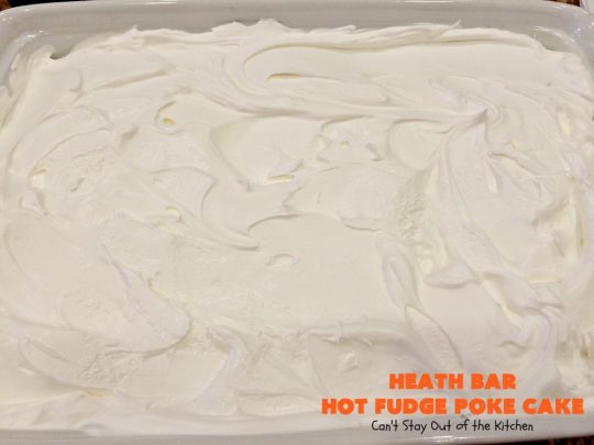 Heath Bar Hot Fudge Poke Cake | Can't Stay Out of the Kitchen | this fantastic #pokecake starts with a #chocolate #cake mix. After baking, it's spread with condensed milk & #hotfudge sauce. Then it's topped with loads of #HeathToffee bars! It is so incredibly amazing & perfect for company or any #holiday party. #dessert