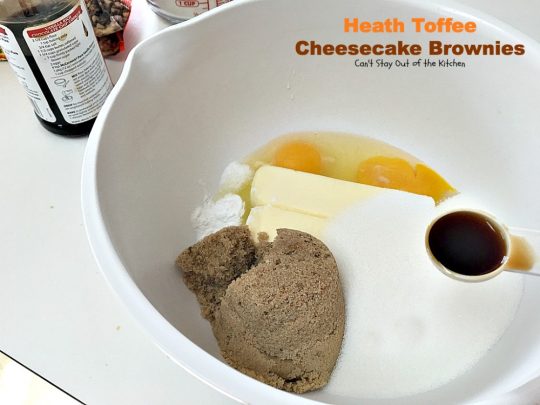 Heath Toffee Cheesecake Brownies | Can't Stay Out of the Kitchen | these #brownies are divine! #HeathEnglishToffeeBits are added to #cookie dough and sandwiched between a luscious #cheesecake layer. This #dessert is amazing.