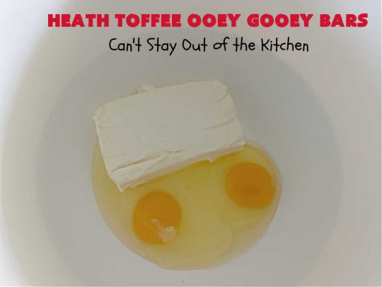 Heath Toffee Ooey Gooey Bars | Can't Stay Out of the Kitchen | These #OoeyGooeyBars are outrageously good! If you want an earth-shattering experience, bake up a batch of these lovely #brownies for your next #tailgating party, potluck or backyard BBQ. This easy #recipe uses only 6 ingredients! #cookies #dessert #HeathEnglishToffeeBits #HeathToffee #HeathToffeeOoeyGooeyBars