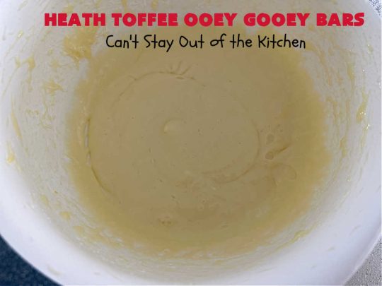 Heath Toffee Ooey Gooey Bars | Can't Stay Out of the Kitchen | These #OoeyGooeyBars are outrageously good! If you want an earth-shattering experience, bake up a batch of these lovely #brownies for your next #tailgating party, potluck or backyard BBQ. This easy #recipe uses only 6 ingredients! #cookies #dessert #HeathEnglishToffeeBits #HeathToffee #HeathToffeeOoeyGooeyBars