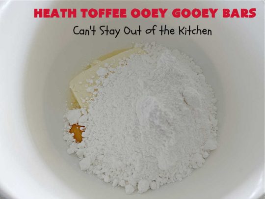 Heath Toffee Ooey Gooey Bars | Can't Stay Out of the Kitchen | These #OoeyGooeyBars are outrageously good! If you want an earth-shattering experience, bake up a batch of these lovely #brownies for your next #tailgating party, potluck or backyard BBQ. This easy #recipe uses only 6 ingredients! #cookies #dessert #HeathEnglishToffeeBits #HeathToffee #HeathToffeeOoeyGooeyBars