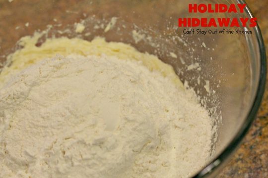 Holiday Hideaways | Can't Stay Out of the Kitchen | these scrumptious #cookies have a #maraschinocherry hidden inside each one! Then they're dunked in #chocolate or #vanilla bark before sprinkling with additional bark shavings. So festive & beautiful for #holiday or #Christmas #baking. #Christmas #ChristmasDessert #ChristmasCookieExchange #cherries #ChocolateDessert #CherryDessert #dessert