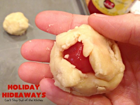 Holiday Hideaways | Can't Stay Out of the Kitchen | these scrumptious #cookies have a #maraschinocherry hidden inside each one! Then they're dunked in #chocolate or #vanilla bark before sprinkling with additional bark shavings. So festive & beautiful for #holiday or #Christmas #baking. #Christmas #ChristmasDessert #ChristmasCookieExchange #cherries #ChocolateDessert #CherryDessert #dessert
