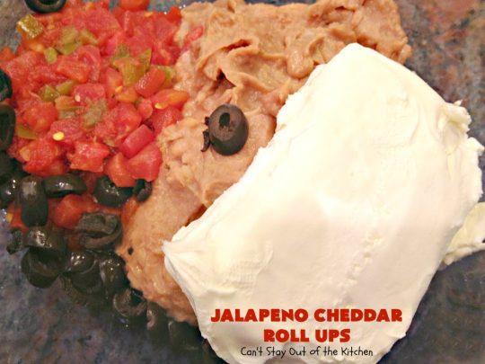 Jalapeno Cheddar Roll Ups | Can't Stay Out of the Kitchen | these fantastic #TexMex #appetizers are terrific for #tailgating, #NewYearsEve or #SuperBowl parties. Filled with #refriedbeans, #chilies, #olives, & lots of #cheese.