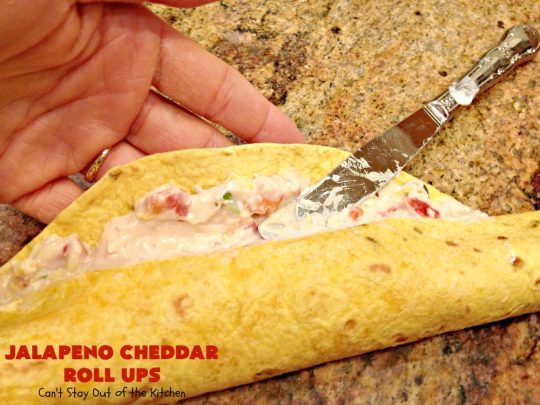 Jalapeno Cheddar Roll Ups | Can't Stay Out of the Kitchen | these fantastic #TexMex #appetizers are terrific for #tailgating, #NewYearsEve or #SuperBowl parties. Filled with #refriedbeans, #chilies, #olives, & lots of #cheese.