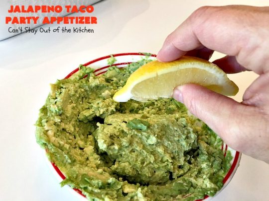 Jalapeno Taco Party Appetizer | Can't Stay Out of the Kitchen | the best #TexMex layered dip ever! This one uses refried beans with jalapenos, #avocados, a sour cream & #taco seasoning layer. Then it's topped with olives, #cheese, green onions and tomatoes. Perfect for #tailgating or #SuperBowl parties. #appetizer