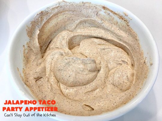 Jalapeno Taco Party Appetizer | Can't Stay Out of the Kitchen | the best #TexMex layered dip ever! This one uses refried beans with jalapenos, #avocados, a sour cream & #taco seasoning layer. Then it's topped with olives, #cheese, green onions and tomatoes. Perfect for #tailgating or #SuperBowl parties. #appetizer