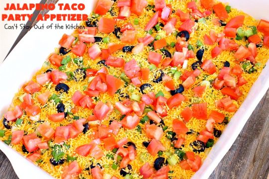 Jalapeno Taco Party Appetizer | Can't Stay Out of the Kitchen | the best #TexMex layered dip ever! This one uses refried beans with jalapenos, #avocados, a sour cream & #taco seasoning layer. Then it's topped with olives, #cheese, green onions and tomatoes. Perfect for #tailgating or #SuperBowl parties. #appetizer