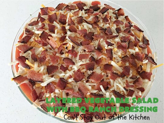 Layered Vegetable Salad with BBQ Ranch Dressing is spectacular! This amazing #salad uses all kinds of fresh #veggies, plus #bacon & two kinds of #cheese: #Cheddar & #MontereyJack. The #BBQRanchDressing is what gives the #recipe such amazing flavor. This #LayeredSalad is terrific for company or #holiday dinners & is #GlutenFree. #eggs #LayeredVegetableSaladWith BBQRanchDressing