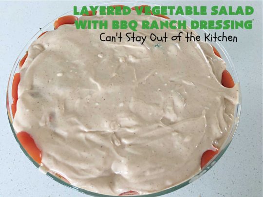 Layered Vegetable Salad with BBQ Ranch Dressing is spectacular! This amazing #salad uses all kinds of fresh #veggies, plus #bacon & two kinds of #cheese: #Cheddar & #MontereyJack. The #BBQRanchDressing is what gives the #recipe such amazing flavor. This #LayeredSalad is terrific for company or #holiday dinners & is #GlutenFree. #eggs #LayeredVegetableSaladWith BBQRanchDressing