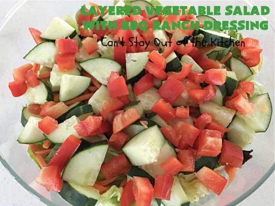 Layered Vegetable Salad with BBQ Ranch Dressing is spectacular! This amazing #salad uses all kinds of fresh #veggies, plus #bacon & two kinds of #cheese: #Cheddar & #MontereyJack. The #BBQRanchDressing is what gives the #recipe such amazing flavor. This #LayeredSalad is terrific for company or #holiday dinners & is #GlutenFree. #eggs #LayeredVegetableSaladWith BBQRanchDressing