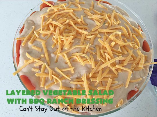 Layered Vegetable Salad with BBQ Ranch Dressing is spectacular! This amazing #salad uses all kinds of fresh #veggies, plus #bacon & two kinds of #cheese: #Cheddar & #MontereyJack. The #BBQRanchDressing is what gives the #recipe such amazing flavor. This #LayeredSalad is terrific for company or #holiday dinners & is #GlutenFree. #eggs #LayeredVegetableSaladWith BBQRanchDressing