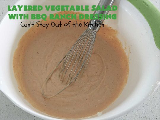 Layered Vegetable Salad with BBQ Ranch Dressing is spectacular! This amazing #salad uses all kinds of fresh #veggies, plus #bacon & two kinds of #cheese: #Cheddar & #MontereyJack. The #BBQRanchDressing is what gives the #recipe such amazing flavor. This #LayeredSalad is terrific for company or #holiday dinners & is #GlutenFree. #eggs #LayeredVegetableSaladWith BBQRanchDressing