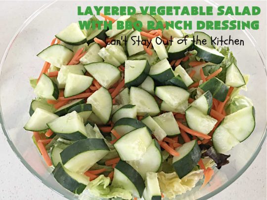 Layered Vegetable Salad with BBQ Ranch Dressing is spectacular! This amazing #salad uses all kinds of fresh #veggies, plus #bacon & two kinds of #cheese: #Cheddar & #MontereyJack. The #BBQRanchDressing is what gives the #recipe such amazing flavor. This #LayeredSalad is terrific for company or #holiday dinners & is #GlutenFree. #eggs #LayeredVegetableSaladWith BBQRanchDressing