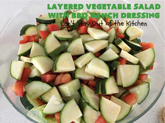 Layered Vegetable Salad with BBQ Ranch Dressing is spectacular! This amazing #salad uses all kinds of fresh #veggies, plus #bacon & two kinds of #cheese: #Cheddar & #MontereyJack. The #BBQRanchDressing is what gives the #recipe such amazing flavor. This #LayeredSalad is terrific for company or #holiday dinners & is #GlutenFree. #eggs #LayeredVegetableSaladWith BBQRanchDressing