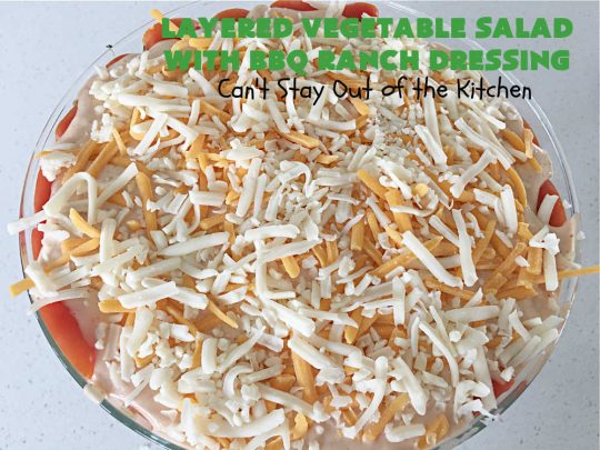 Layered Vegetable Salad with BBQ Ranch Dressing is spectacular! This amazing #salad uses all kinds of fresh #veggies, plus #bacon & two kinds of #cheese: #Cheddar & #MontereyJack. The #BBQRanchDressing is what gives the #recipe such amazing flavor. This #LayeredSalad is terrific for company or #holiday dinners & is #GlutenFree. #eggs #LayeredVegetableSaladWith BBQRanchDressing