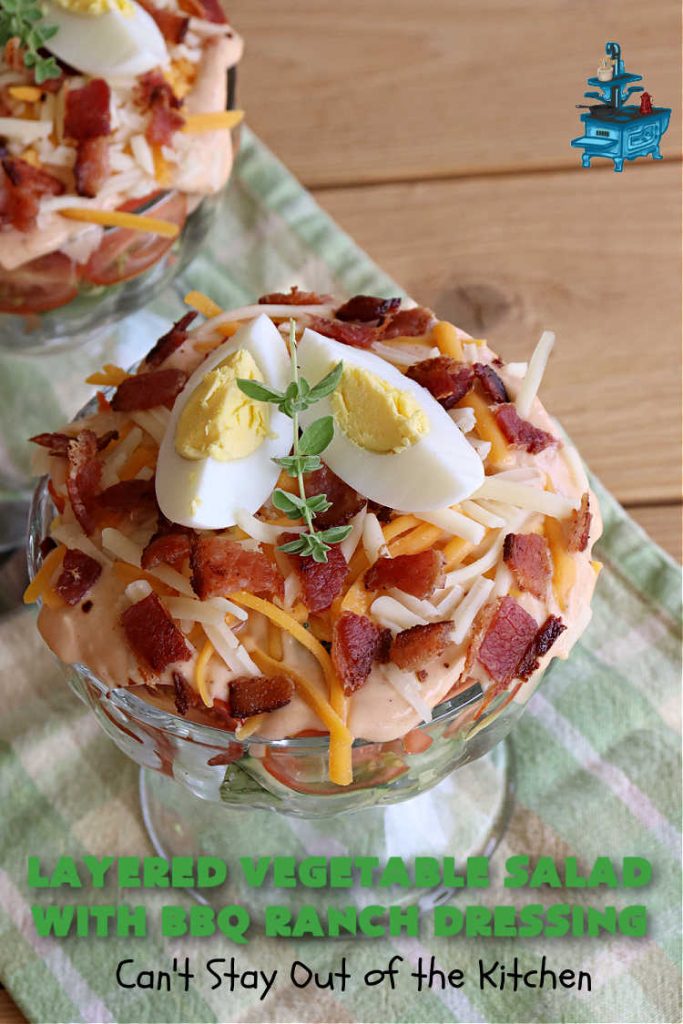 Layered Vegetable Salad with BBQ Ranch Dressing is spectacular! This amazing #salad uses all kinds of fresh #veggies, plus #bacon & two kinds of #cheese: #Cheddar & #MontereyJack. The #BBQRanchDressing is what gives the #recipe such amazing flavor. This #LayeredSalad is terrific for company or #holiday dinners & is #GlutenFree. #eggs #LayeredVegetableSaladWith BBQRanchDressing