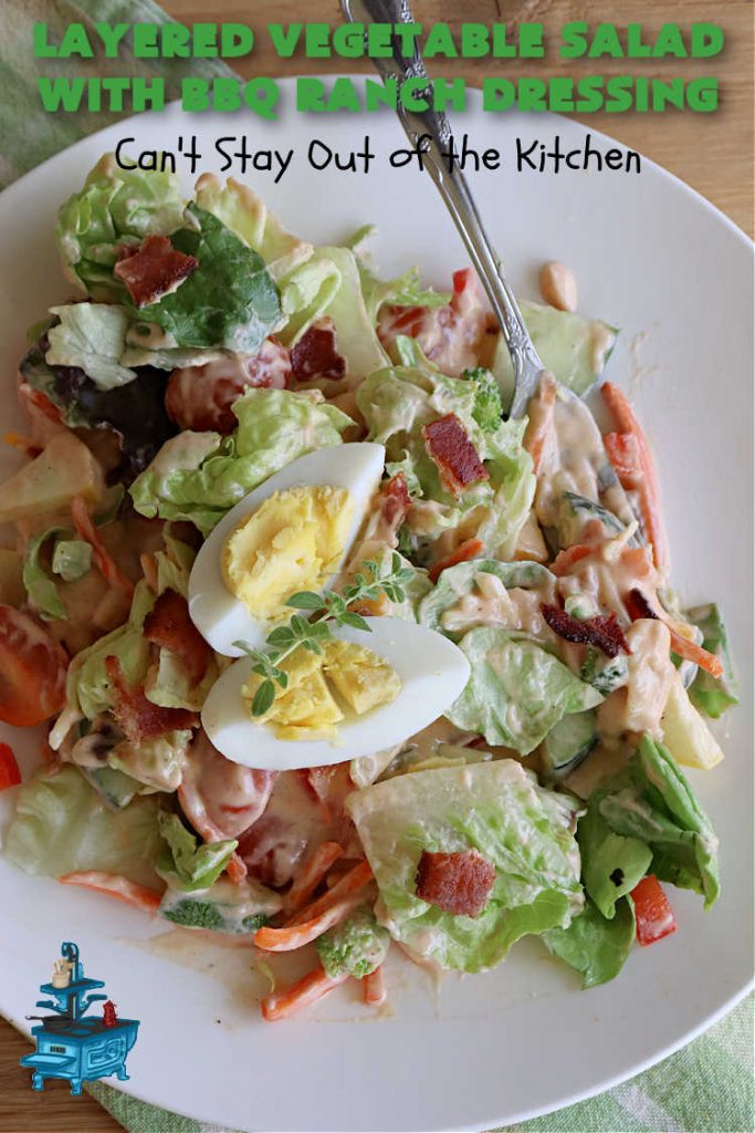Layered Vegetable Salad with BBQ Ranch Dressing is spectacular! This amazing #salad uses all kinds of fresh #veggies, plus #bacon & two kinds of #cheese: #Cheddar & #MontereyJack. The #BBQRanchDressing is what gives the #recipe such amazing flavor. This #LayeredSalad is terrific for company or #holiday dinners & is #GlutenFree. #eggs #LayeredVegetableSaladWith BBQRanchDressing