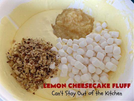Lemon Cheesecake Fluff | Can't Stay Out of the Kitchen | this spectacular "fluff"-type #FruitSalad is terrific for company or #holiday dinners. It includes #CreamCheese, #CheesecakePuddingMix, #Lemon #JellO, miniature #marshmallows, #CoolWhip & #walnuts.Serve it in a trifle dish, glass bowl or parfait glasses for special occasions. #LemonCheesecakeFluff #salad