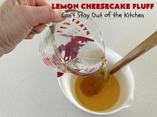 Lemon Cheesecake Fluff | Can't Stay Out of the Kitchen | this spectacular "fluff"-type #FruitSalad is terrific for company or #holiday dinners. It includes #CreamCheese, #CheesecakePuddingMix, #Lemon #JellO, miniature #marshmallows, #CoolWhip & #walnuts.Serve it in a trifle dish, glass bowl or parfait glasses for special occasions. #LemonCheesecakeFluff #salad