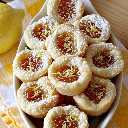 Lemon Curd Tarts | Can't Stay Out of the Kitchen | This awesome 6 ingredient #recipe is perfect for #holiday #baking & #ChristmasCookieExchanges. These festive #cookies are filled with #LemonCurd & are absolutely delightful. Every bite will have you drooling! #lemons #dessert #LemonDessert #LemonCurdTarts