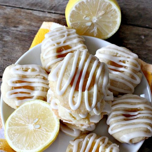 Lemon Curd Thumbprint Cookies | Can't Stay Out of the Kitchen | these delectable #thumbprintcookies are terrific for the #holidays & #Christmas #baking. #LemonCurd gives them a little bite & the vanilla icing on top makes them sweetly heavenly. #cookies #dessert #lemon #LemonDessert #HolidayDessert #ChristmasDessert #ChristmasCookieExchange #ChristmasCookie