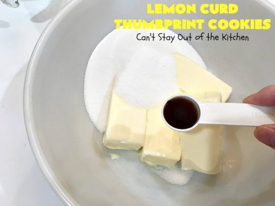 Lemon Curd Thumbprint Cookies | Can't Stay Out of the Kitchen | these delectable #thumbprintcookies are terrific for the #holidays & #Christmas #baking. #LemonCurd gives them a little bite & the vanilla icing on top makes them sweetly heavenly. #cookies #dessert #lemon #LemonDessert #HolidayDessert #ChristmasDessert #ChristmasCookieExchange #ChristmasCookie