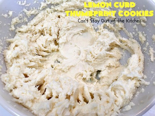 Lemon Curd Thumbprint Cookies | Can't Stay Out of the Kitchen | these delectable #thumbprintcookies are terrific for the #holidays & #Christmas #baking. #LemonCurd gives them a little bite & the vanilla icing on top makes them sweetly heavenly. #cookies #dessert #lemon #LemonDessert #HolidayDessert #ChristmasDessert #ChristmasCookieExchange #ChristmasCookie
