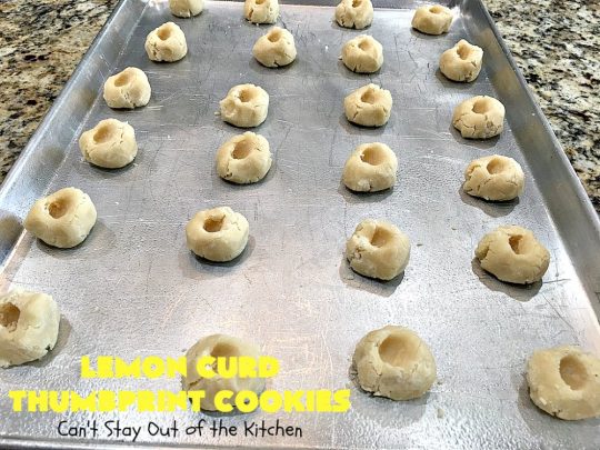 Lemon Curd Thumbprint Cookies | Can't Stay Out of the Kitchen | these delectable #thumbprintcookies are terrific for the #holidays & #Christmas #baking. #LemonCurd gives them a little bite & the vanilla icing on top makes them sweetly heavenly. #cookies #dessert #lemon #LemonDessert #HolidayDessert #ChristmasDessert #ChristmasCookieExchange #ChristmasCookie