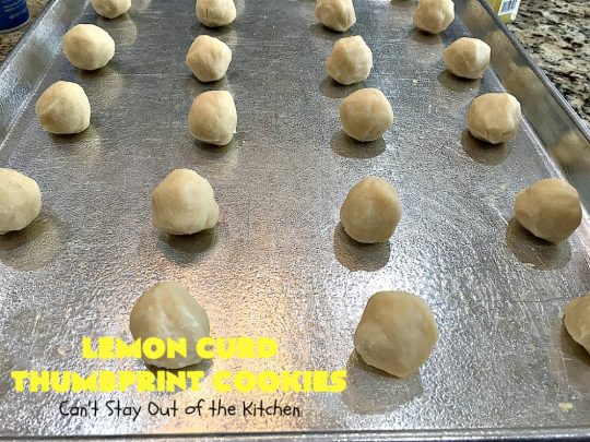 Lemon Curd Thumbprint Cookies | Can't Stay Out of the Kitchen | these delectable #thumbprintcookies are terrific for the #holidays & #Christmas #baking. #LemonCurd gives them a little bite & the vanilla icing on top makes them sweetly heavenly. #cookies #dessert #lemon #LemonDessert #HolidayDessert #ChristmasDessert #ChristmasCookieExchange #ChristmasCookie