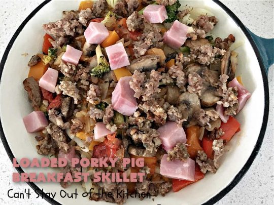 Loaded Porky Pig Breakfast Skillet | Can't Stay Out of the Kitchen | this fantastic #BreakfastSkillet includes #ham, #sausage & #bacon along with lots of fresh veggies, two kinds of #cheese, #HashBrowns & #eggs. It's irresistible & mouthwatering along with being a very filling and satisfying #breakfast entree for weekends or #holidays. If you enjoy big breakfasts, this one can't be beat! #LoadedPorkyPigBreakfastSkillet #pork #SkilletBreakfast #MontereyJackCheese #CheddarCheese