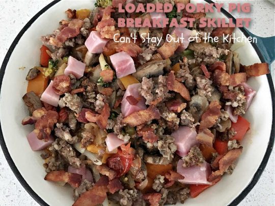 Loaded Porky Pig Breakfast Skillet | Can't Stay Out of the Kitchen | this fantastic #BreakfastSkillet includes #ham, #sausage & #bacon along with lots of fresh veggies, two kinds of #cheese, #HashBrowns & #eggs. It's irresistible & mouthwatering along with being a very filling and satisfying #breakfast entree for weekends or #holidays. If you enjoy big breakfasts, this one can't be beat! #LoadedPorkyPigBreakfastSkillet #pork #SkilletBreakfast #MontereyJackCheese #CheddarCheese