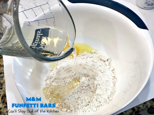M&M Funfetti Bars | Can't Stay Out of the Kitchen | this easy 6-ingredient #recipe will knock your socks off! Every bite is so rich, decadent & divine. If you enjoy the flavors of #MMs & #Funfetti, you'll love these luscious #dessert #brownies. Great for #tailgating, potlucks or #holiday #baking. #MMFunfettiBars #ConfettiCakeMix #ChocolateDessert #cookies #MMDessert #6IngredientBrownies #chocolate