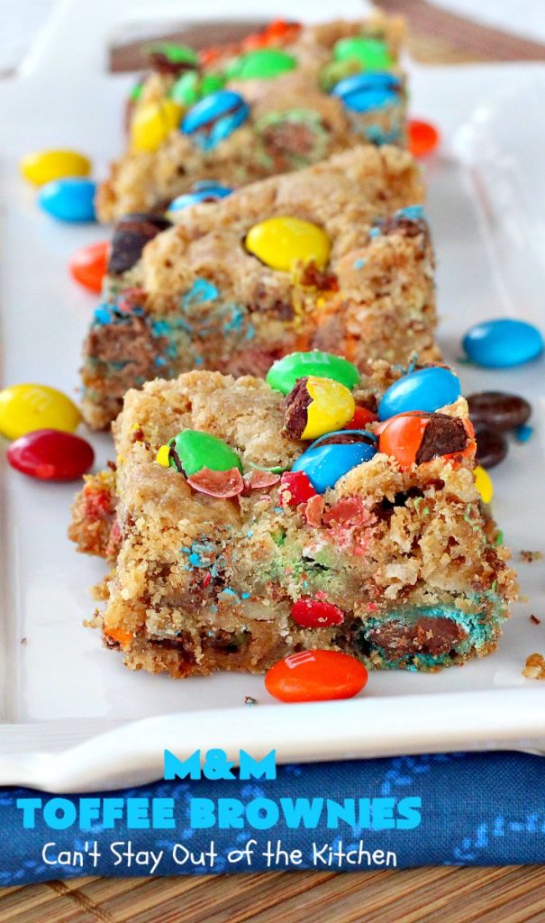 M&M Toffee Brownies | Can't Stay Out of the Kitchen | these #brownies are nothing short of sensational! They're filled with #MMs, #coconut, #pecans & #HeathEnglishToffeeBits. Terrific for #tailgating parties, potlucks, backyard BBQs & summer #holiday fun like #FourthOfJuly. #MMDessert #chocolate #HolidayDessert #ToffeeDessert #toffee #ChocolateDessert