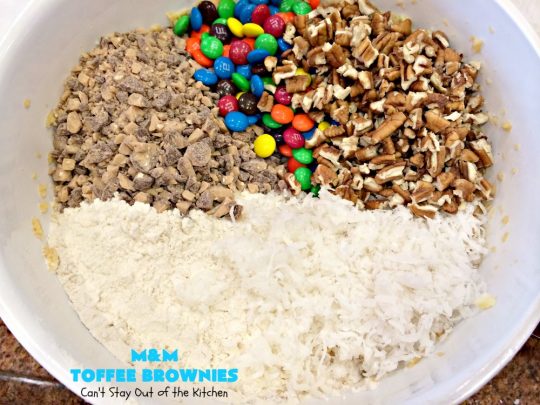 M&M Toffee Brownies | Can't Stay Out of the Kitchen | these #brownies are nothing short of sensational! They're filled with #MMs, #coconut, #pecans & #HeathEnglishToffeeBits. Terrific for #tailgating parties, potlucks, backyard BBQs & summer #holiday fun like #FourthOfJuly. #MMDessert #chocolate #HolidayDessert #ToffeeDessert #toffee #ChocolateDessert