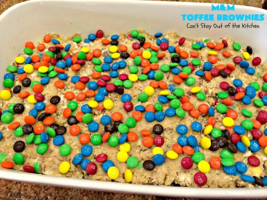 M&M Toffee Brownies | Can't Stay Out of the Kitchen | these #brownies are nothing short of sensational! They're filled with #MMs, #coconut, #pecans & #HeathEnglishToffeeBits. Terrific for #tailgating parties, potlucks, backyard BBQs & summer #holiday fun like #FourthOfJuly. #MMDessert #chocolate #HolidayDessert #ToffeeDessert #toffee #ChocolateDessert
