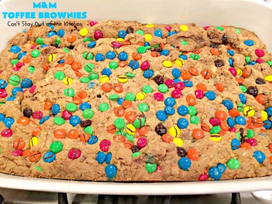 M&M Toffee Brownies | Can't Stay Out of the Kitchen | these #brownies are nothing short of sensational! They're filled with #MMs, #coconut, #pecans & #HeathEnglishToffeeBits. Terrific for #tailgating parties, potlucks, backyard BBQs & summer #holiday fun like #FourthOfJuly. #MMDessert #chocolate #HolidayDessert #ToffeeDessert #toffee #ChocolateDessert