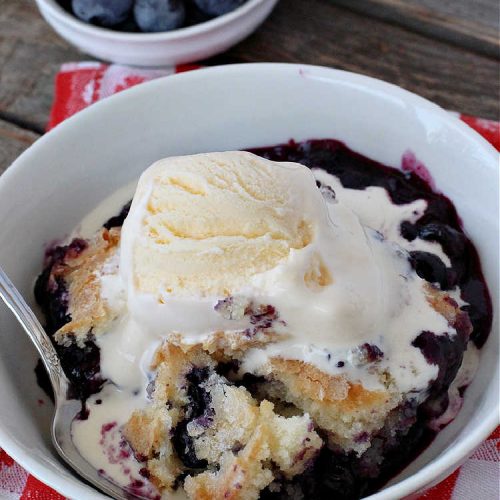 Magic Blueberry Cobbler | Can't Stay Out of the Kitchen | this #cobbler really is magic! It's layered with fresh #blueberries, then a topping and finally it has a sugar glaze on top like glazed donuts! Perfect for a company or #holiday #dessert. #HolidayDessert #BlueberryCobbler #BlueberryDessert #MagicBlueberryCobbler