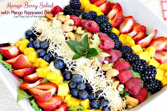 Mango Berry Salad with Mango Poppyseed Dressing | Can't Stay Out of the Kitchen | this amazing #salad has double the #mango flavor. Filled with #strawberries #raspberries #blueberries #blackberries & #swisscheese. We love this #salad. #glutenfree #cleaneating