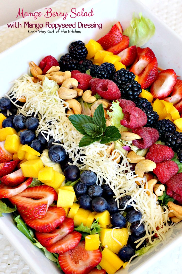 Mango Berry Salad with Mango Poppyseed Dressing | Can't Stay Out of the Kitchen | this amazing #salad has double the #mango flavor. Filled with #strawberries #raspberries #blueberries #blackberries & #swisscheese. We love this #salad. #glutenfree #cleaneating