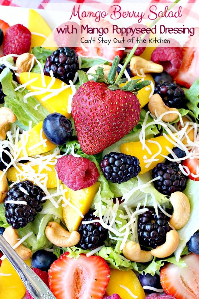 Mango Berry Salad with Mango Poppyseed Dressing | Can't Stay Out of the Kitchen | this amazing #salad has double the #mango flavor. Filled with #strawberries #raspberries #blueberries #blackberries & #swisscheese. We love this #salad. #glutenfree #cleaneating