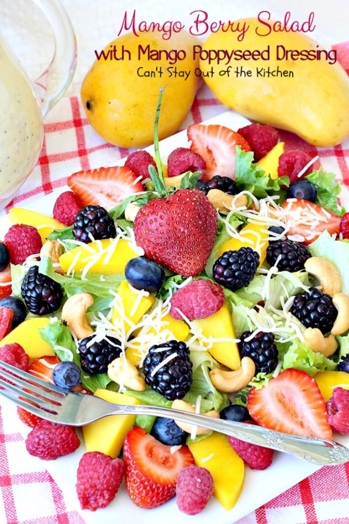 Mango Berry Salad with Mango Poppyseed Dressing | Can't Stay Out of the Kitchen | this amazing #salad has double the #mango flavor. Filled with #strawberries #raspberries #blueberries #blackberries & #swisscheese. We love this #salad. #glutenfree #cleaneating