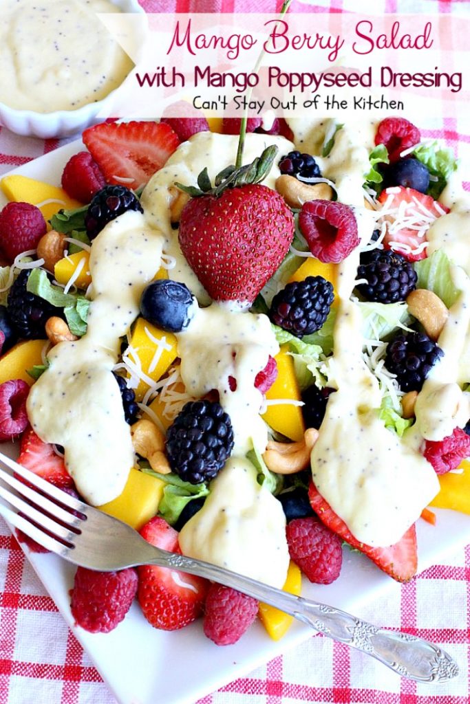 Mango Berry Salad with Mango Poppyseed Dressing | Can't Stay Out of the Kitchen | this amazing #salad has double the #mango flavor. Filled with #strawberries #raspberries #blueberries #blackberries & #swisscheese. We love this #salad. #glutenfree #cleaneating