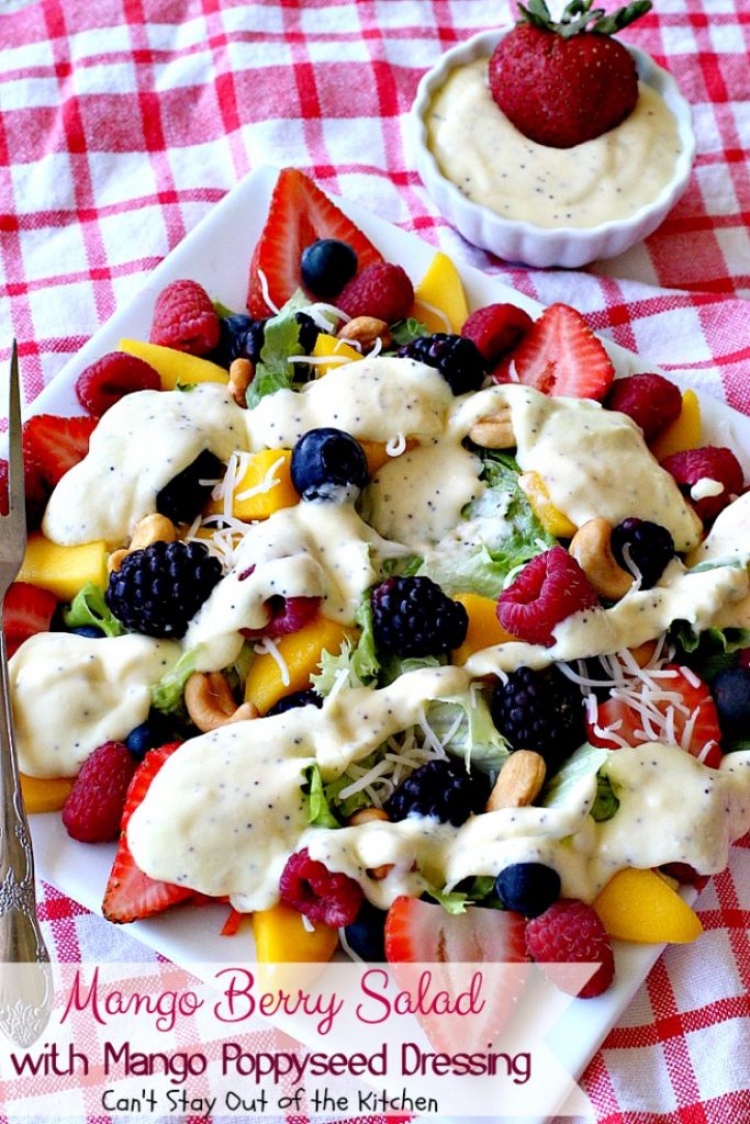 Mango Berry Salad with Mango Poppyseed Dressing | Can't Stay Out of the Kitchen | this amazing #salad has double the #mango flavor. Filled with #strawberries #raspberries #blueberries #blackberries & #swisscheese. We love this #salad. #glutenfree #cleaneating