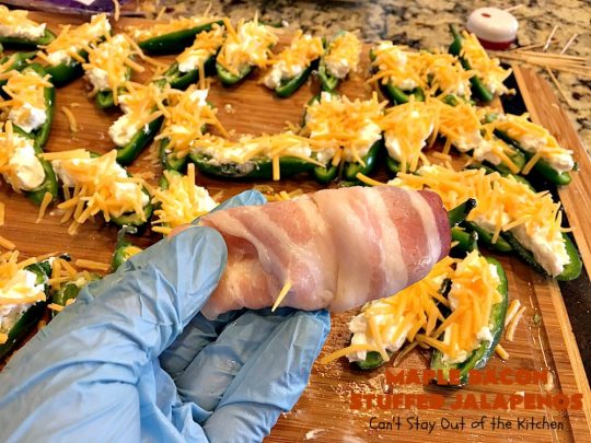 Maple Bacon Stuffed Jalapenos | Can't Stay Out of the Kitchen | this spectacular #appetizer is a 6 ingredient #recipe. #Bacon wrapped #jalapenos are stuffed with #creamcheese & #cheddarcheese & drizzled with #maplesyrup after baking. Our company loved them! They're perfect for any #holiday party or potluck. #appetizer #glutenfree #tailgating