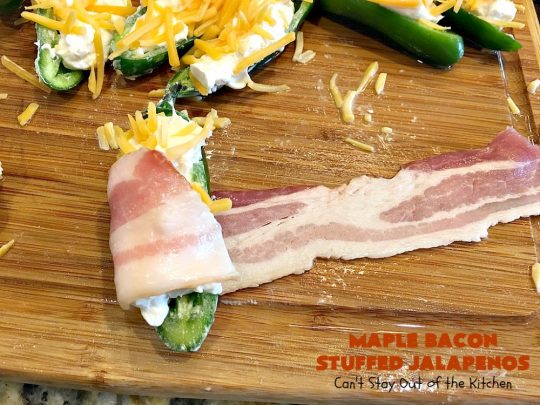Maple Bacon Stuffed Jalapenos | Can't Stay Out of the Kitchen | this spectacular #appetizer is a 6 ingredient #recipe. #Bacon wrapped #jalapenos are stuffed with #creamcheese & #cheddarcheese & drizzled with #maplesyrup after baking. Our company loved them! They're perfect for any #holiday party or potluck. #appetizer #glutenfree #tailgating